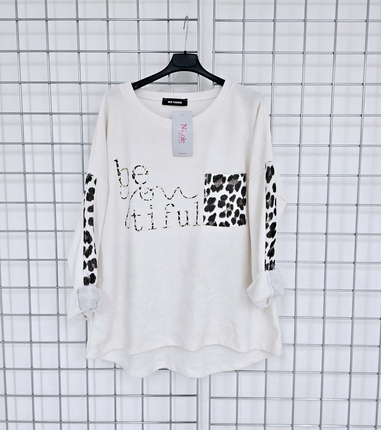 Imogen corduroy top with contrast animal print pocket and 'Be you tiful' logo.