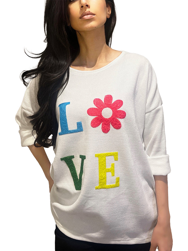 Women's wholesale chenille top with embossed 'LOVE' design and flower detail for the 'O', perfect for spring