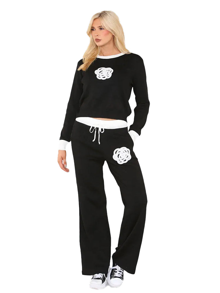 Women's knit jumper and wide leg trouser coord set with applique flower detail, featuring an elasticated waist