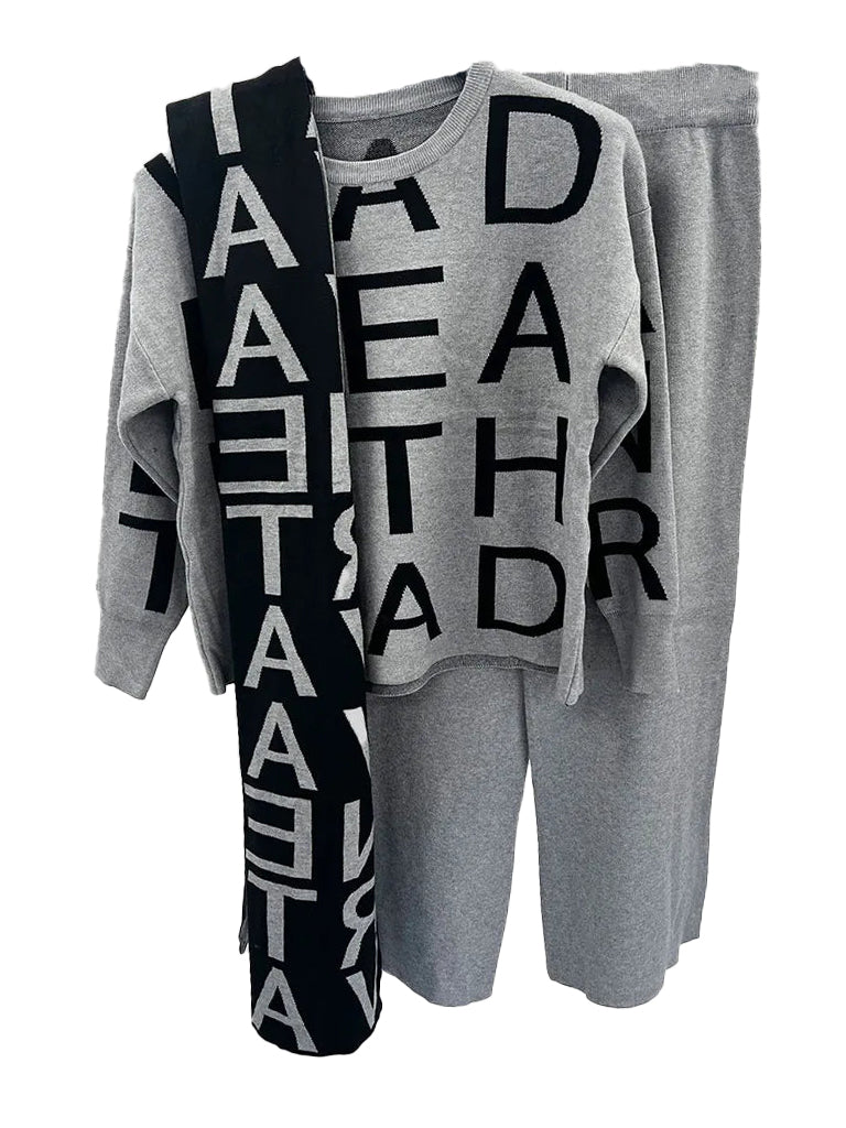 Women's wholesale 3-piece knit coord set featuring a lettered jumper, matching trousers, and a reversible scarf