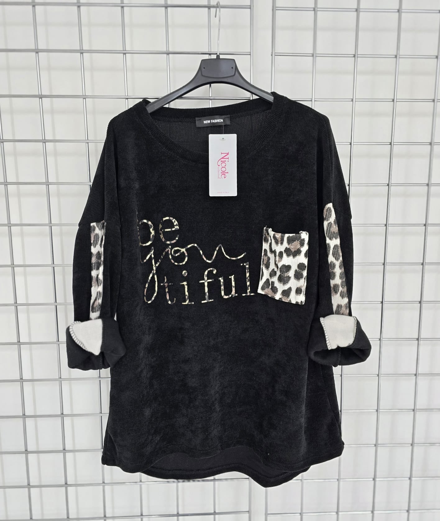 Imogen corduroy top with contrast animal print pocket and 'Be you tiful' logo.
