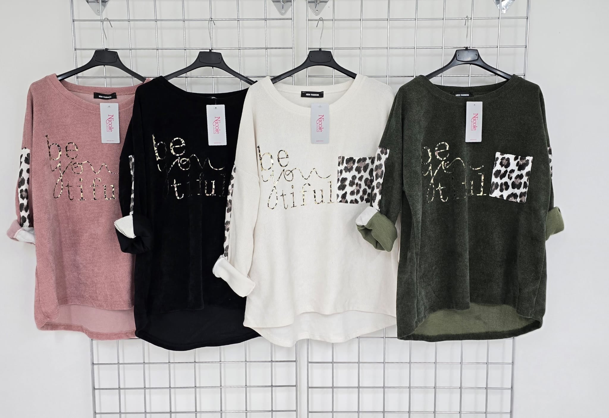 Imogen corduroy top with contrast animal print pocket and 'Be you tiful' logo.