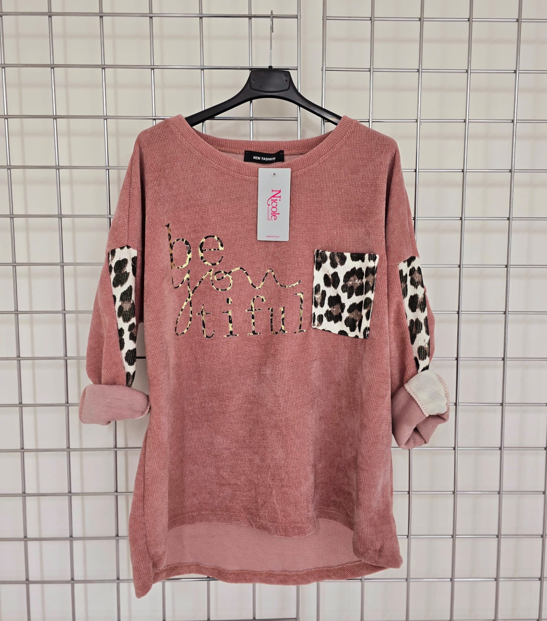 Imogen corduroy top with contrast animal print pocket and 'Be you tiful' logo.