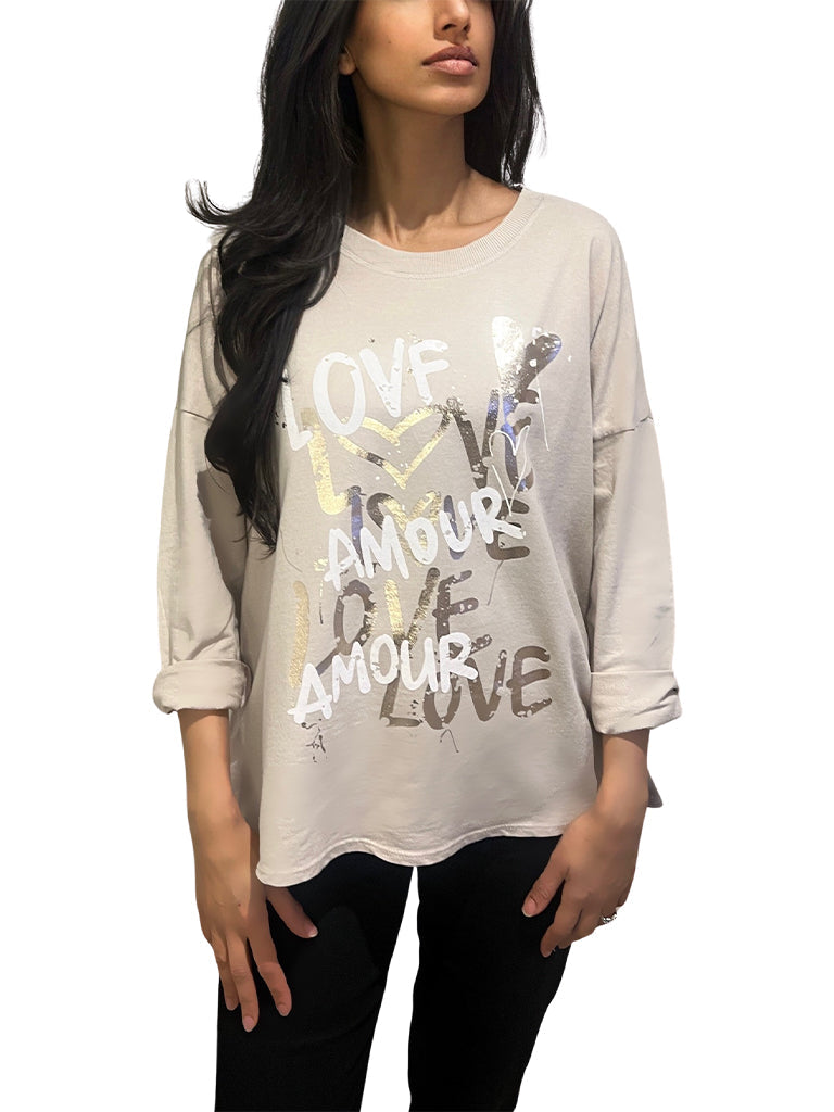 Women's wholesale dipped hem top with graffiti-style 'Love Amour' print and roll-up sleeves