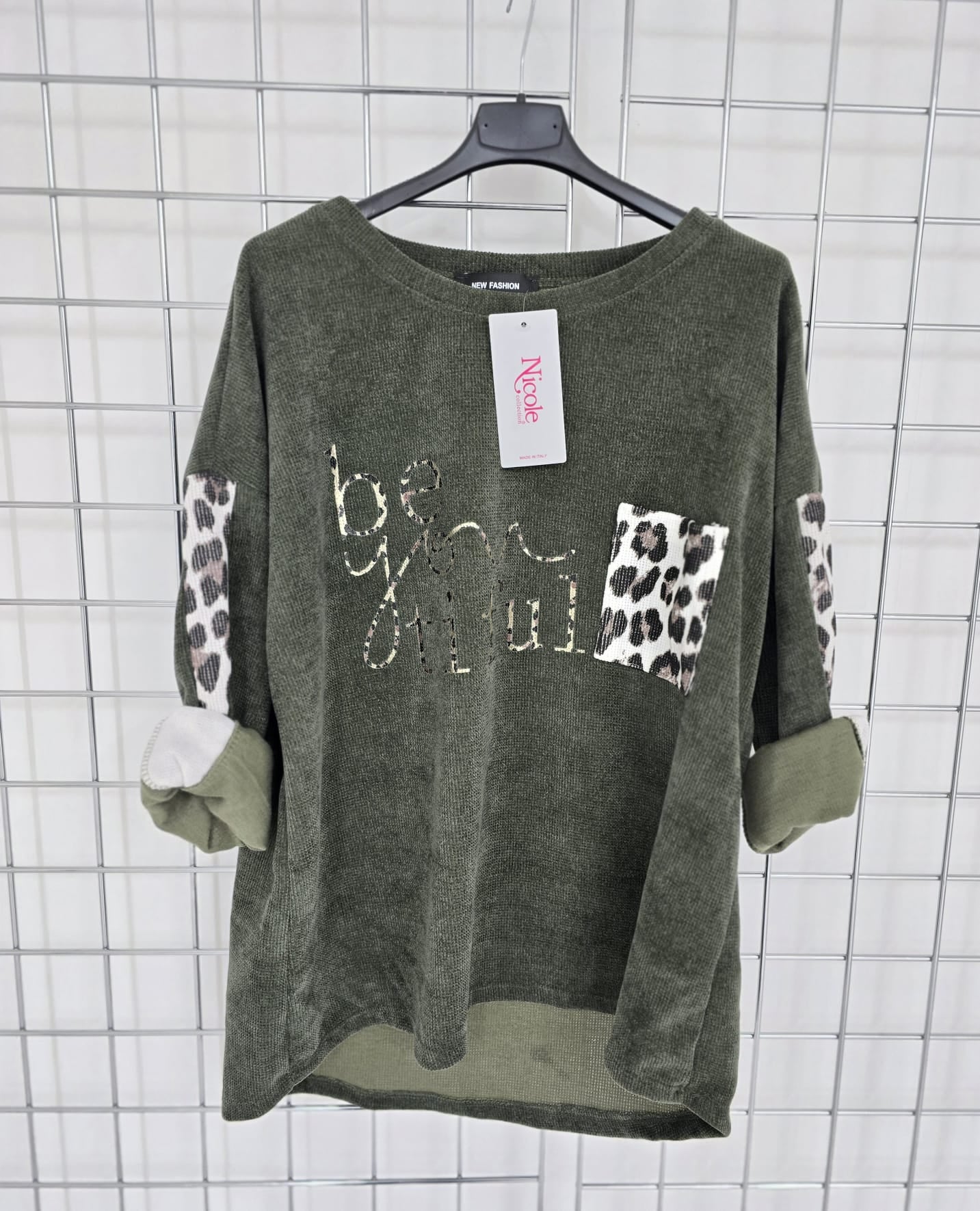 Imogen corduroy top with contrast animal print pocket and 'Be you tiful' logo.